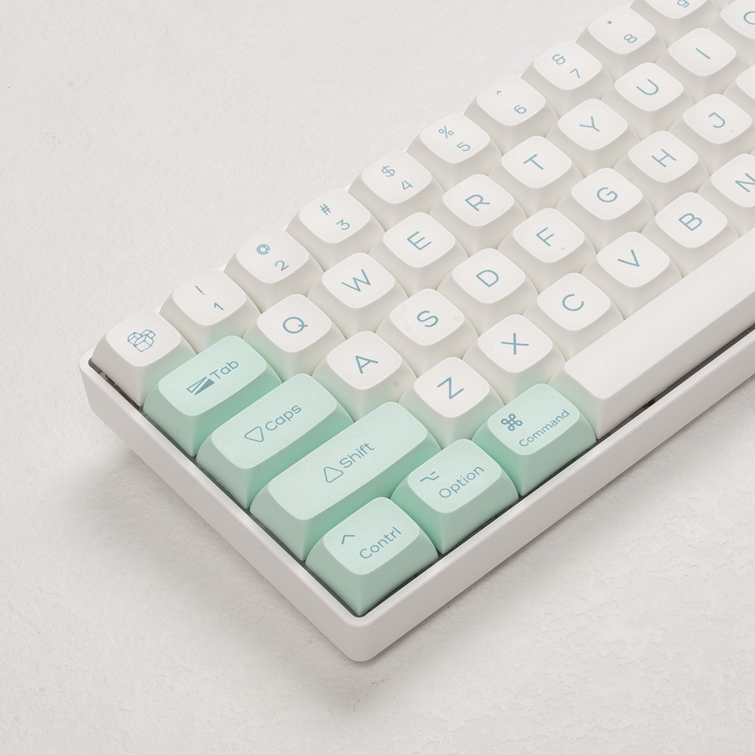 Close-up of the mint modifiers and cream alpha keys showing the mid-blue dye-sublimated legends